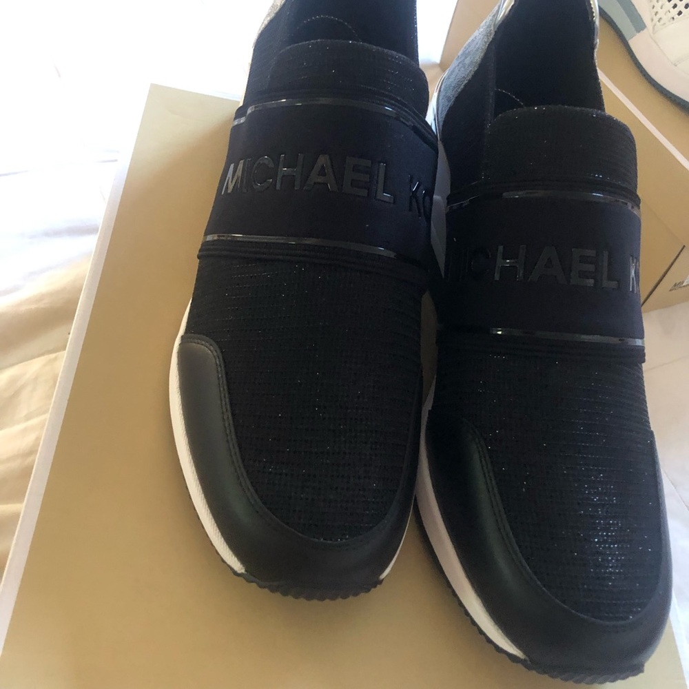 Micheal Kors black slip on tennis shoesl